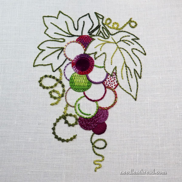 embroider grapes and vine leaves